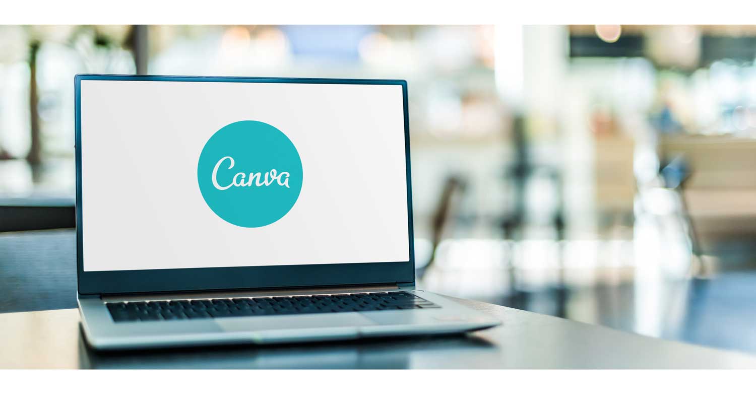 laptop with canva logo on screen